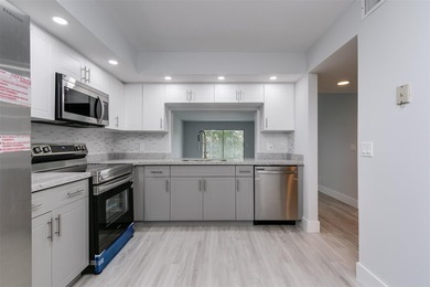 Updated 2 bedroom, 2 bath condo in Century Village in excellent on Flamingo Lakes Country Club in Florida - for sale on GolfHomes.com, golf home, golf lot