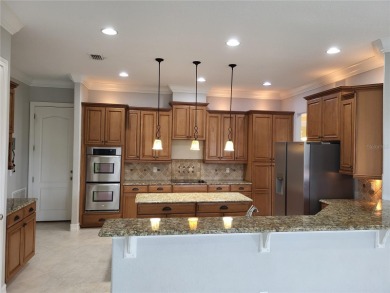 Discover this impressive two-story residence in the highly on Eagle Creek Golf Club in Florida - for sale on GolfHomes.com, golf home, golf lot