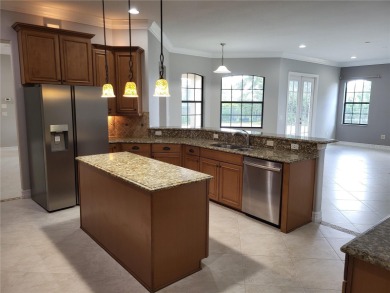 Discover this impressive two-story residence in the highly on Eagle Creek Golf Club in Florida - for sale on GolfHomes.com, golf home, golf lot