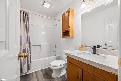 This inviting two-bedroom, two-bath townhome combines comfort on Smithfields Country Club in South Carolina - for sale on GolfHomes.com, golf home, golf lot