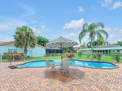 Spacious 3BR/2.5BA home in the prestigious Woodlands of Tamarac on Woodlands Country Club in Florida - for sale on GolfHomes.com, golf home, golf lot