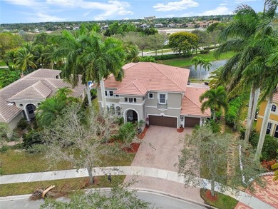 Beautiful 4-bedroom + loft (easily convertible to a 5th bedroom) on Heron Bay Golf Club in Florida - for sale on GolfHomes.com, golf home, golf lot
