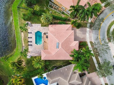 Beautiful 4-bedroom + loft (easily convertible to a 5th bedroom) on Heron Bay Golf Club in Florida - for sale on GolfHomes.com, golf home, golf lot