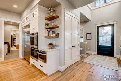 Harmony Club Stunner offering a perfect balance of refined on Harmony Golf Club in Colorado - for sale on GolfHomes.com, golf home, golf lot