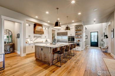 Harmony Club Stunner offering a perfect balance of refined on Harmony Golf Club in Colorado - for sale on GolfHomes.com, golf home, golf lot