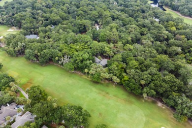 Nestled on a half-acre homesite beneath majestic oak trees on The Seabrook Island Club in South Carolina - for sale on GolfHomes.com, golf home, golf lot