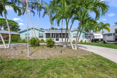 Remarkable Opportunity! Discover this Remodeled Concrete Block on Miles Grant Country Club in Florida - for sale on GolfHomes.com, golf home, golf lot