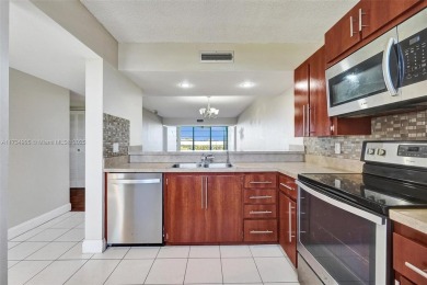 THIS 2 BEDROOM 2 BATHROOM WHITEHIALL 1 CONDO IS LOCATED IN A on Pine Island Ridge Country Club in Florida - for sale on GolfHomes.com, golf home, golf lot