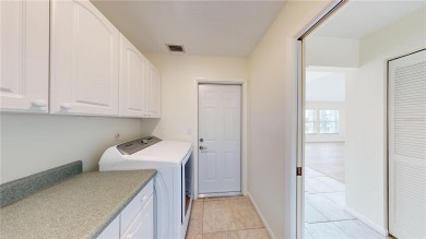 Welcome to this beautifully updated 3-bedroom, 2-bath pool home on Twin Isles Country Club in Florida - for sale on GolfHomes.com, golf home, golf lot
