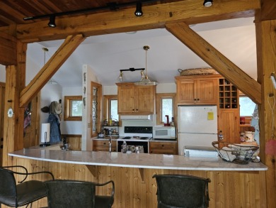 STUNNING TURNKEY CUSTOM-BUILT TIMBER FRAME HOME ON LOST LAKE on Lost Nation Golf Club in Illinois - for sale on GolfHomes.com, golf home, golf lot