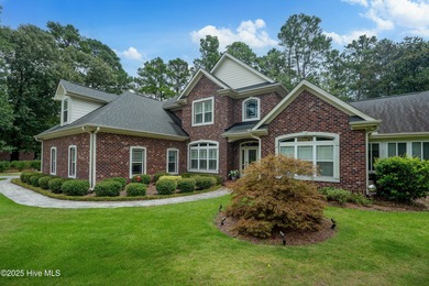 Welcome to 704 Squire Lane, where timeless elegance meets modern on Porters Neck Country Club in North Carolina - for sale on GolfHomes.com, golf home, golf lot