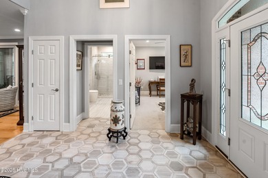 Welcome to 704 Squire Lane, where timeless elegance meets modern on Porters Neck Country Club in North Carolina - for sale on GolfHomes.com, golf home, golf lot