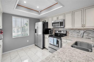 Welcome to a condo that instantly feels like home the moment you on East Lake Woodlands Country Club in Florida - for sale on GolfHomes.com, golf home, golf lot