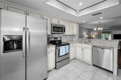 Welcome to a condo that instantly feels like home the moment you on East Lake Woodlands Country Club in Florida - for sale on GolfHomes.com, golf home, golf lot