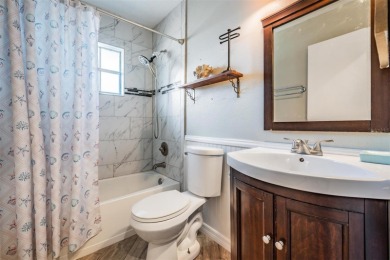 Welcome to this beautifully maintained 3-bedroom, 2-bathroom on Oak Hills Country Club in Florida - for sale on GolfHomes.com, golf home, golf lot