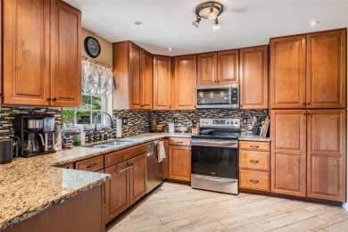 Welcome to this beautifully maintained 3-bedroom, 2-bathroom on Oak Hills Country Club in Florida - for sale on GolfHomes.com, golf home, golf lot