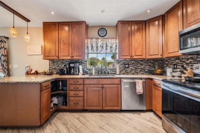 Welcome to this beautifully maintained 3-bedroom, 2-bathroom on Oak Hills Country Club in Florida - for sale on GolfHomes.com, golf home, golf lot