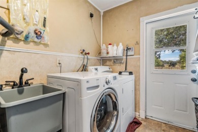 Welcome to this beautifully maintained 3-bedroom, 2-bathroom on Oak Hills Country Club in Florida - for sale on GolfHomes.com, golf home, golf lot