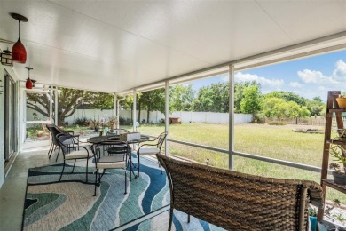 Welcome to this beautifully maintained 3-bedroom, 2-bathroom on Oak Hills Country Club in Florida - for sale on GolfHomes.com, golf home, golf lot