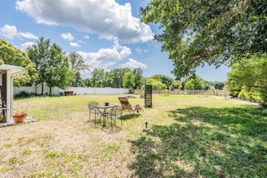 Welcome to this beautifully maintained 3-bedroom, 2-bathroom on Oak Hills Country Club in Florida - for sale on GolfHomes.com, golf home, golf lot