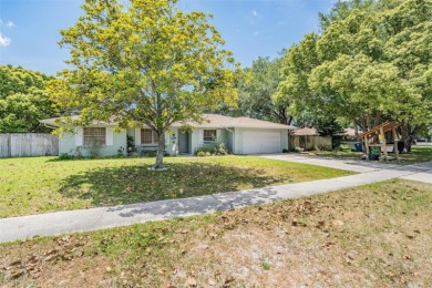 Welcome to this beautifully maintained 3-bedroom, 2-bathroom on Oak Hills Country Club in Florida - for sale on GolfHomes.com, golf home, golf lot