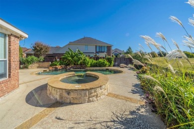 This stunning two-story home is located in the highly on Mansfield National Golf Club in Texas - for sale on GolfHomes.com, golf home, golf lot