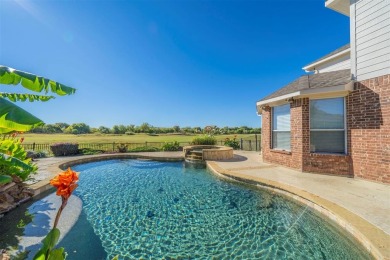 This stunning two-story home is located in the highly on Mansfield National Golf Club in Texas - for sale on GolfHomes.com, golf home, golf lot