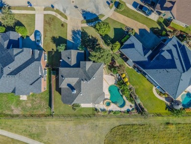 This stunning two-story home is located in the highly on Mansfield National Golf Club in Texas - for sale on GolfHomes.com, golf home, golf lot