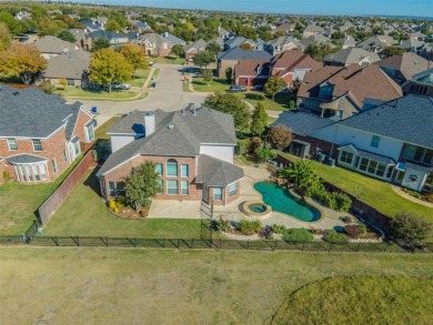 This stunning two-story home is located in the highly on Mansfield National Golf Club in Texas - for sale on GolfHomes.com, golf home, golf lot