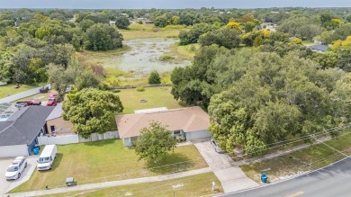 Welcome to this beautifully maintained 3-bedroom, 2-bathroom on Oak Hills Country Club in Florida - for sale on GolfHomes.com, golf home, golf lot