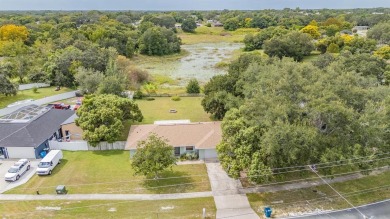 Welcome to this beautifully maintained 3-bedroom, 2-bathroom on Oak Hills Country Club in Florida - for sale on GolfHomes.com, golf home, golf lot
