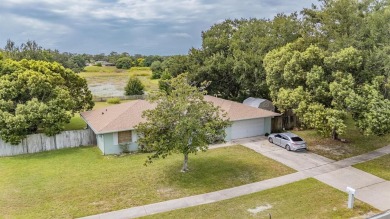 Welcome to this beautifully maintained 3-bedroom, 2-bathroom on Oak Hills Country Club in Florida - for sale on GolfHomes.com, golf home, golf lot