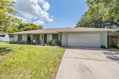 Welcome to this beautifully maintained 3-bedroom, 2-bathroom on Oak Hills Country Club in Florida - for sale on GolfHomes.com, golf home, golf lot