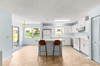 Popular Delphina End Unit Villa located in the Crescent Ridge on On Top of the World Golf Course in Florida - for sale on GolfHomes.com, golf home, golf lot