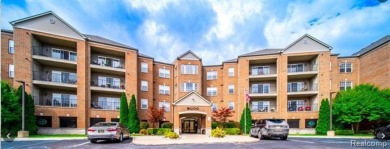 GORGEOUS UPSCALE 4TH FLOOR UNIT OVERLOOKING THE GOLF COURSE on St. Clair Shores Country Club in Michigan - for sale on GolfHomes.com, golf home, golf lot