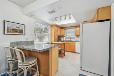 Pride of ownership is evident in this 2-bedroom, 3 full-bath on The Dunedin Country Club in Florida - for sale on GolfHomes.com, golf home, golf lot