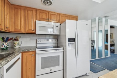 Pride of ownership is evident in this 2-bedroom, 3 full-bath on The Dunedin Country Club in Florida - for sale on GolfHomes.com, golf home, golf lot