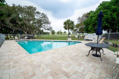 Welcome to the charming Green Dolphin community in the heart of on Tarpon Springs Golf Course in Florida - for sale on GolfHomes.com, golf home, golf lot