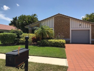 Adorable 3/2 pool home with lake views. Lowest price for a on Boca Greens Country Club in Florida - for sale on GolfHomes.com, golf home, golf lot