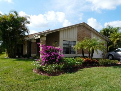 Adorable 3/2 pool home with lake views. Lowest price for a on Boca Greens Country Club in Florida - for sale on GolfHomes.com, golf home, golf lot