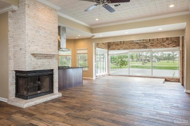 Upon opening the door to this brick 3 bedroom, 2 bath home in on Tiger Point Golf and Country Club in Florida - for sale on GolfHomes.com, golf home, golf lot