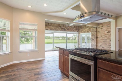 Upon opening the door to this brick 3 bedroom, 2 bath home in on Tiger Point Golf and Country Club in Florida - for sale on GolfHomes.com, golf home, golf lot