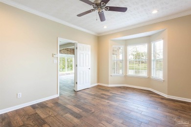 Upon opening the door to this brick 3 bedroom, 2 bath home in on Tiger Point Golf and Country Club in Florida - for sale on GolfHomes.com, golf home, golf lot