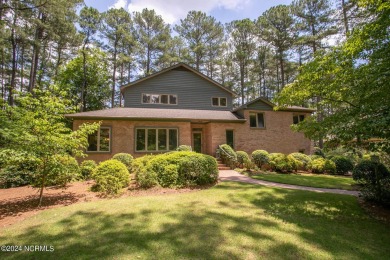 This wonderful brick, golf and waterfront home is situated on on Pinewild Country Club of Pinehurst in North Carolina - for sale on GolfHomes.com, golf home, golf lot