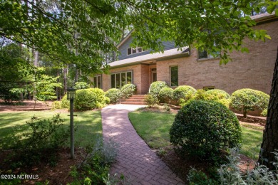 This wonderful brick, golf and waterfront home is situated on on Pinewild Country Club of Pinehurst in North Carolina - for sale on GolfHomes.com, golf home, golf lot