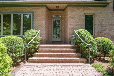 This wonderful brick, golf and waterfront home is situated on on Pinewild Country Club of Pinehurst in North Carolina - for sale on GolfHomes.com, golf home, golf lot