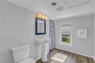 This Salt Box-inspired beauty, echoes the cozy charm of early on Tides Inn Par 3 Course in Virginia - for sale on GolfHomes.com, golf home, golf lot
