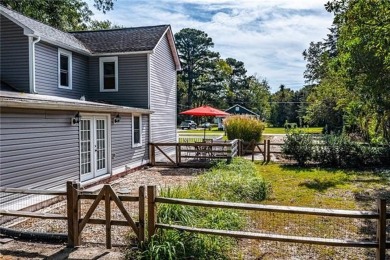 This Salt Box-inspired beauty, echoes the cozy charm of early on Tides Inn Par 3 Course in Virginia - for sale on GolfHomes.com, golf home, golf lot