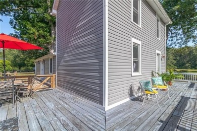 This Salt Box-inspired beauty, echoes the cozy charm of early on Tides Inn Par 3 Course in Virginia - for sale on GolfHomes.com, golf home, golf lot