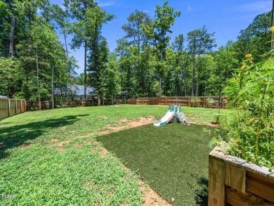 Resort-style living awaits in this beautifully crafted 2023 on River Golf and County Club at Lake Royale in North Carolina - for sale on GolfHomes.com, golf home, golf lot